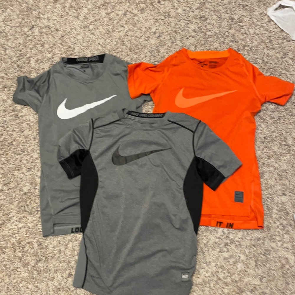 Nike Combat & Nike Pro dri-fit compression shirts. Fitted.